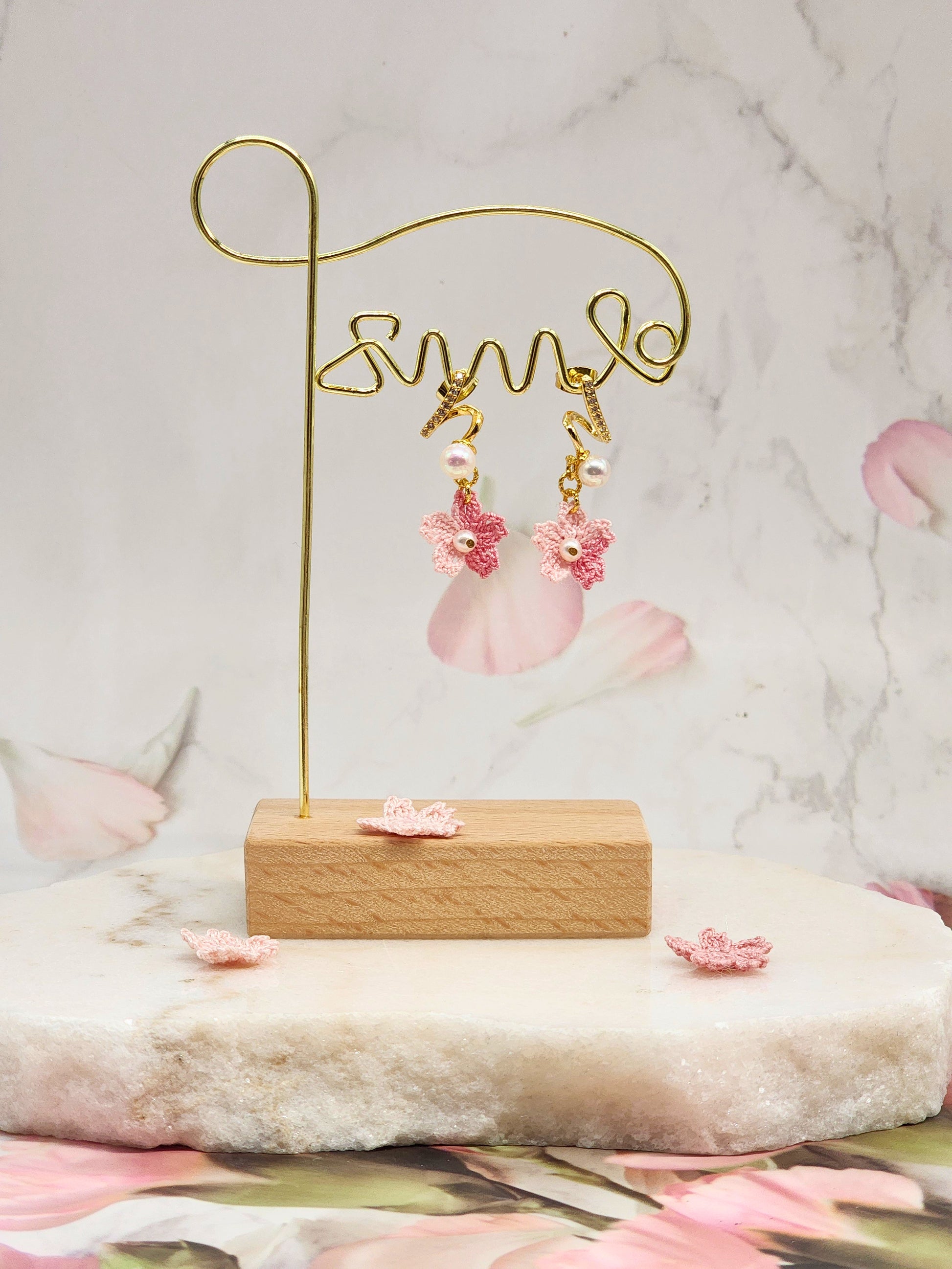 Aurora pearls and sparkling cubic zirconia meet micro crochet Sakura blossoms. 18K gold-plated.