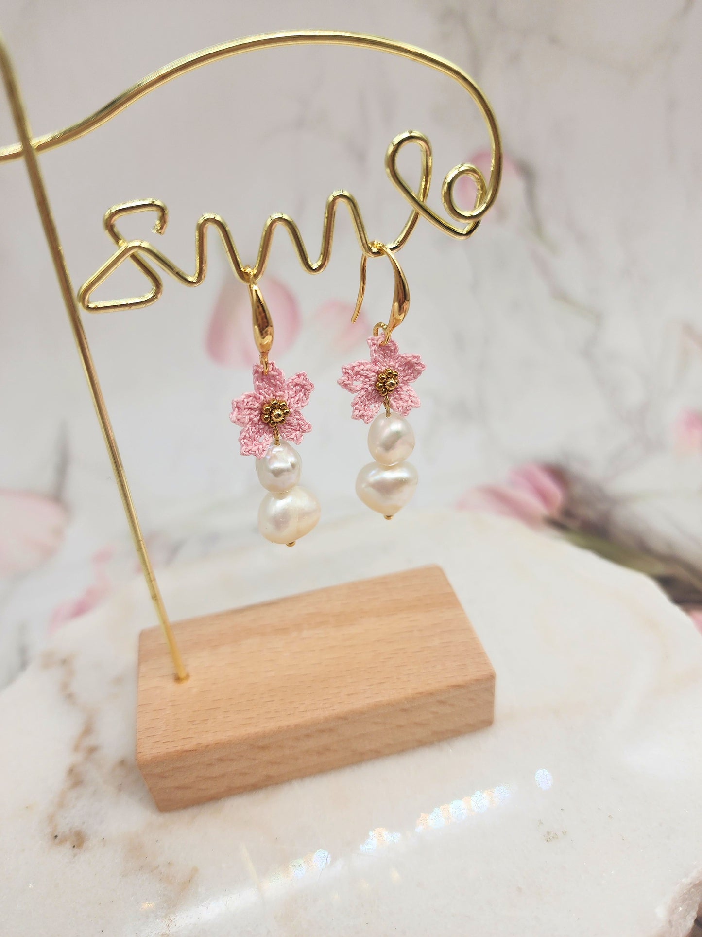 Delicate handcrafted micro crochet Sakura blossoms and bold 9–10mm baroque pearls earrings. 18K gold-plated ear hooks.