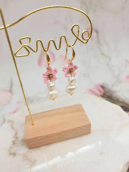 Delicate handcrafted micro crochet Sakura blossoms and bold 9–10mm baroque pearls earrings. 18K gold-plated ear hooks.