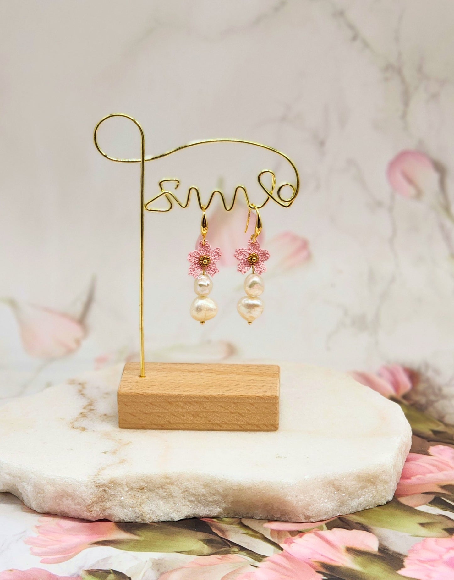 Delicate handcrafted micro crochet Sakura blossoms and bold 9–10mm baroque pearls earrings. 18K gold-plated ear hooks.