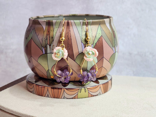 Handcrafted micro-crochet pink snowdrops with Czech crystals and natural Amethyst crystals. 18K gold-plated ear hooks. 
