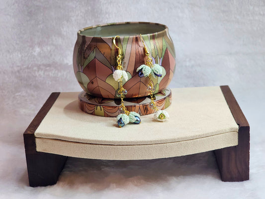 Handcrafted micro-crochet snowdrops & 4-5mm peacock blue pearls chandelier earrings. Miyuki waterdrop glass beads, on 18K gold-plated findings & hooks. 