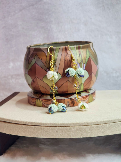 Handcrafted micro-crochet snowdrops & 4-5mm peacock blue pearls chandelier earrings. Miyuki waterdrop glass beads, on 18K gold-plated findings & hooks. 