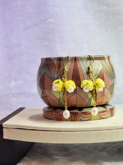Handcrafted micro-crochet snowdrops and 6-7mm pearls dangling earrings. 18K gold-plated findings & hooks. 