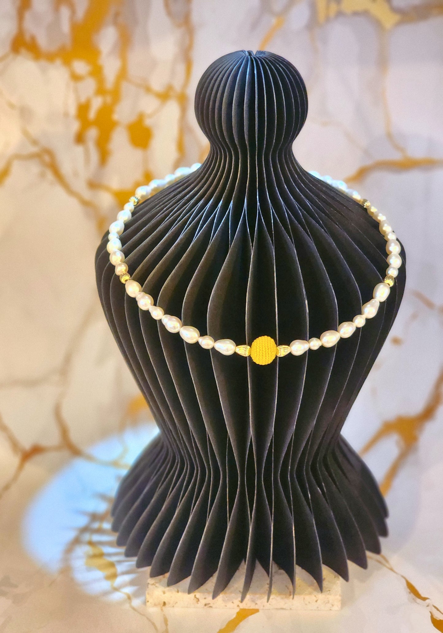 Handcrafted gold crochet pearl beautifully framed by 7–9mm high-lustre, near-flawless teardrop pearls.  Complemented by 18K gold-plated accent beads and an elegant clasp.