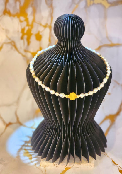 Handcrafted gold crochet pearl beautifully framed by 7–9mm high-lustre, near-flawless teardrop pearls.  Complemented by 18K gold-plated accent beads and an elegant clasp.