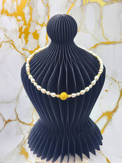 Handcrafted gold crochet pearl beautifully framed by 7–9mm high-lustre, near-flawless teardrop pearls.  Complemented by 18K gold-plated accent beads and an elegant clasp.