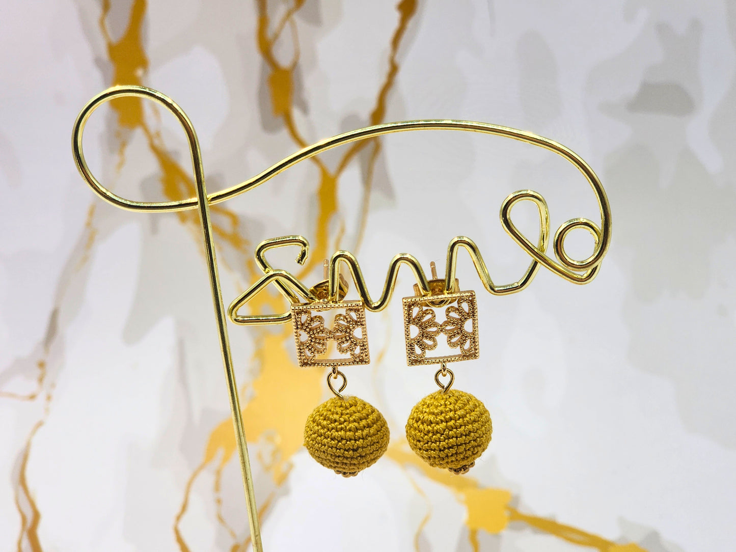 Handcrafted gold crochet pearls inspired by luxurious South Sea pearls. Finished with 18K gold-plated lace studs.