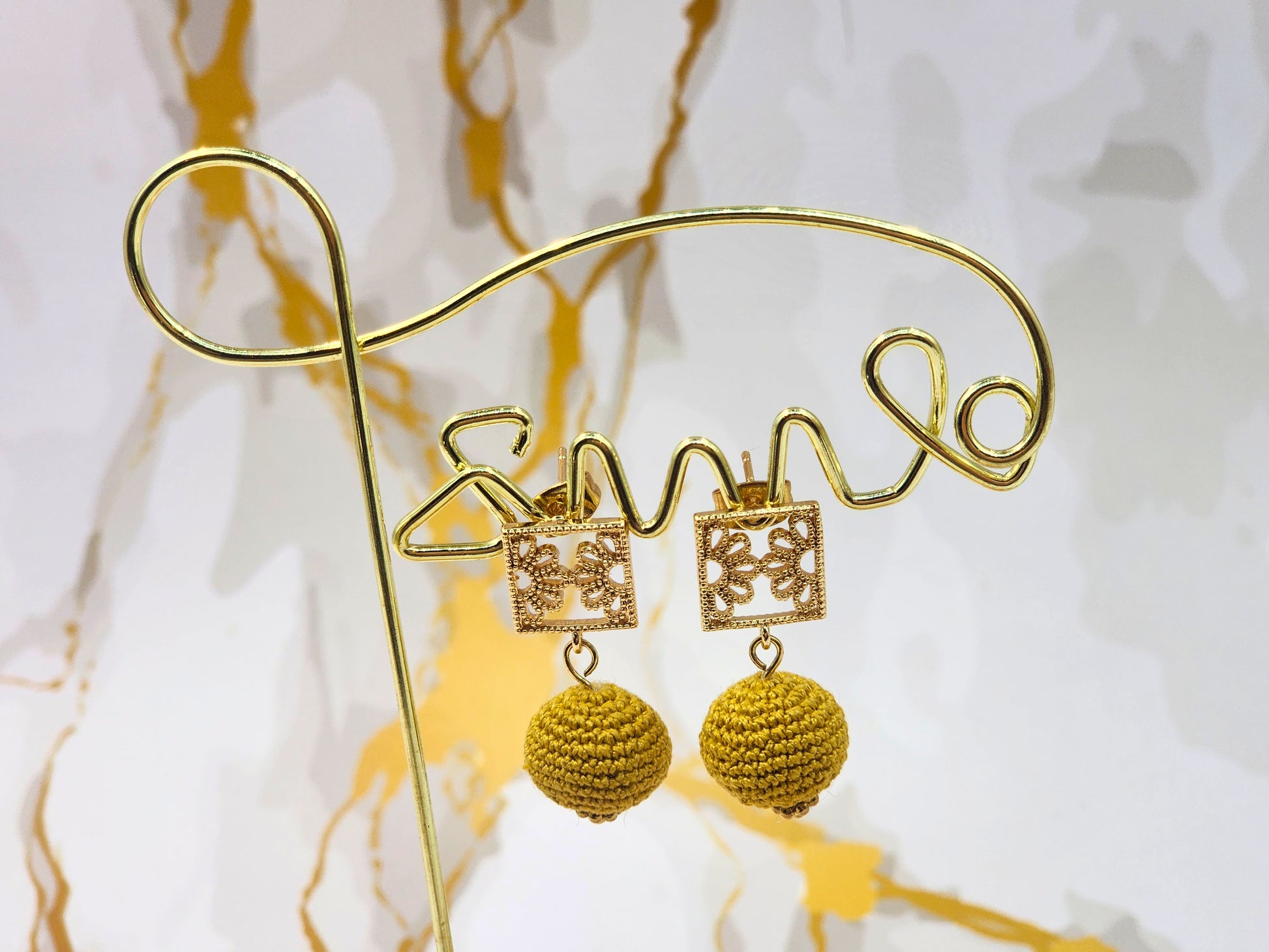 Handcrafted gold crochet pearls inspired by luxurious South Sea pearls. Finished with 18K gold-plated lace studs.