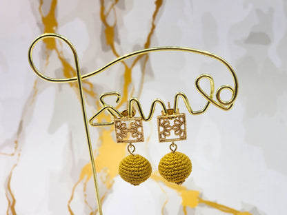 Handcrafted gold crochet pearls inspired by luxurious South Sea pearls. Finished with 18K gold-plated lace studs.