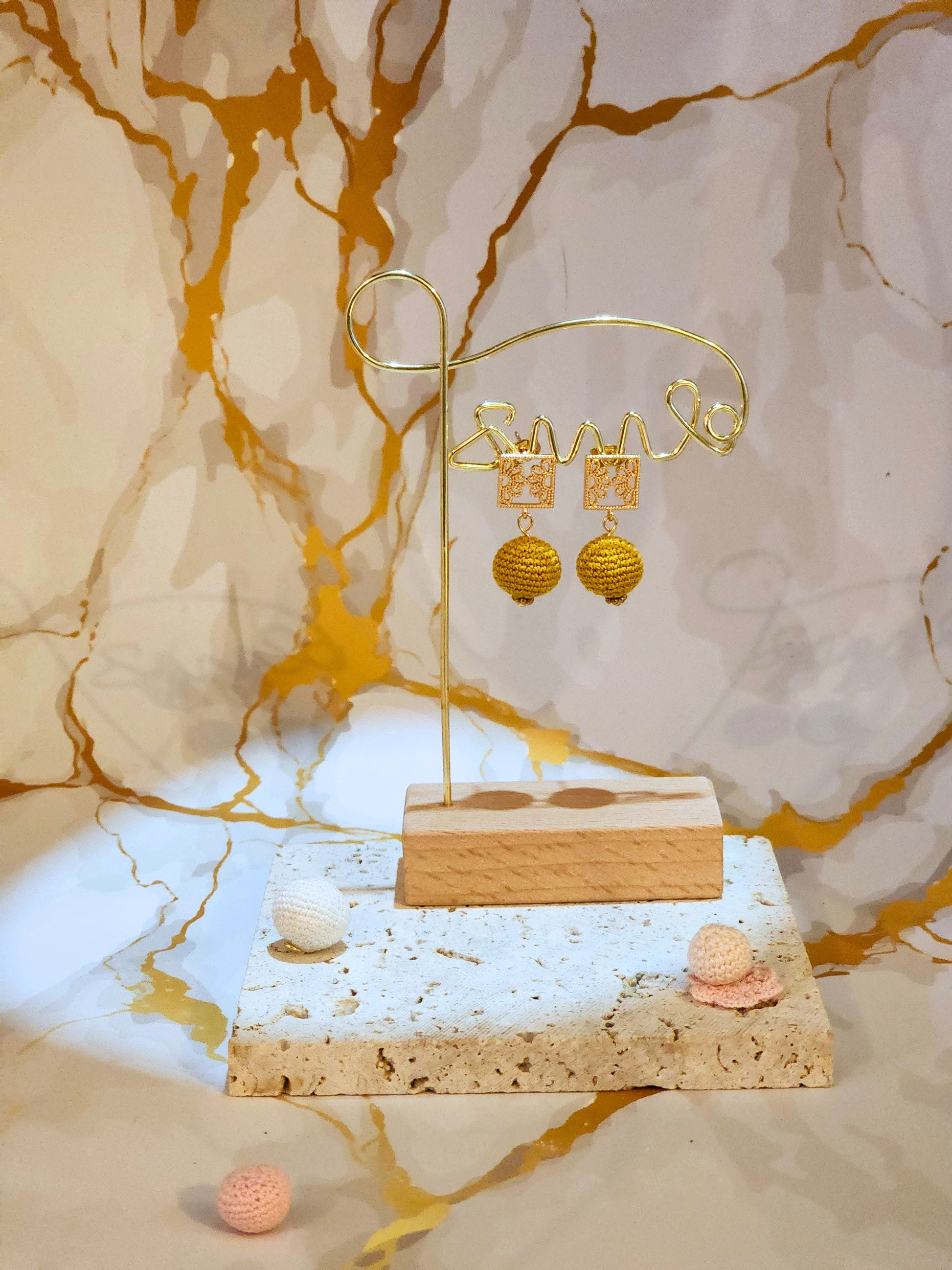 Handcrafted gold crochet pearls inspired by luxurious South Sea pearls. Finished with 18K gold-plated lace studs.
