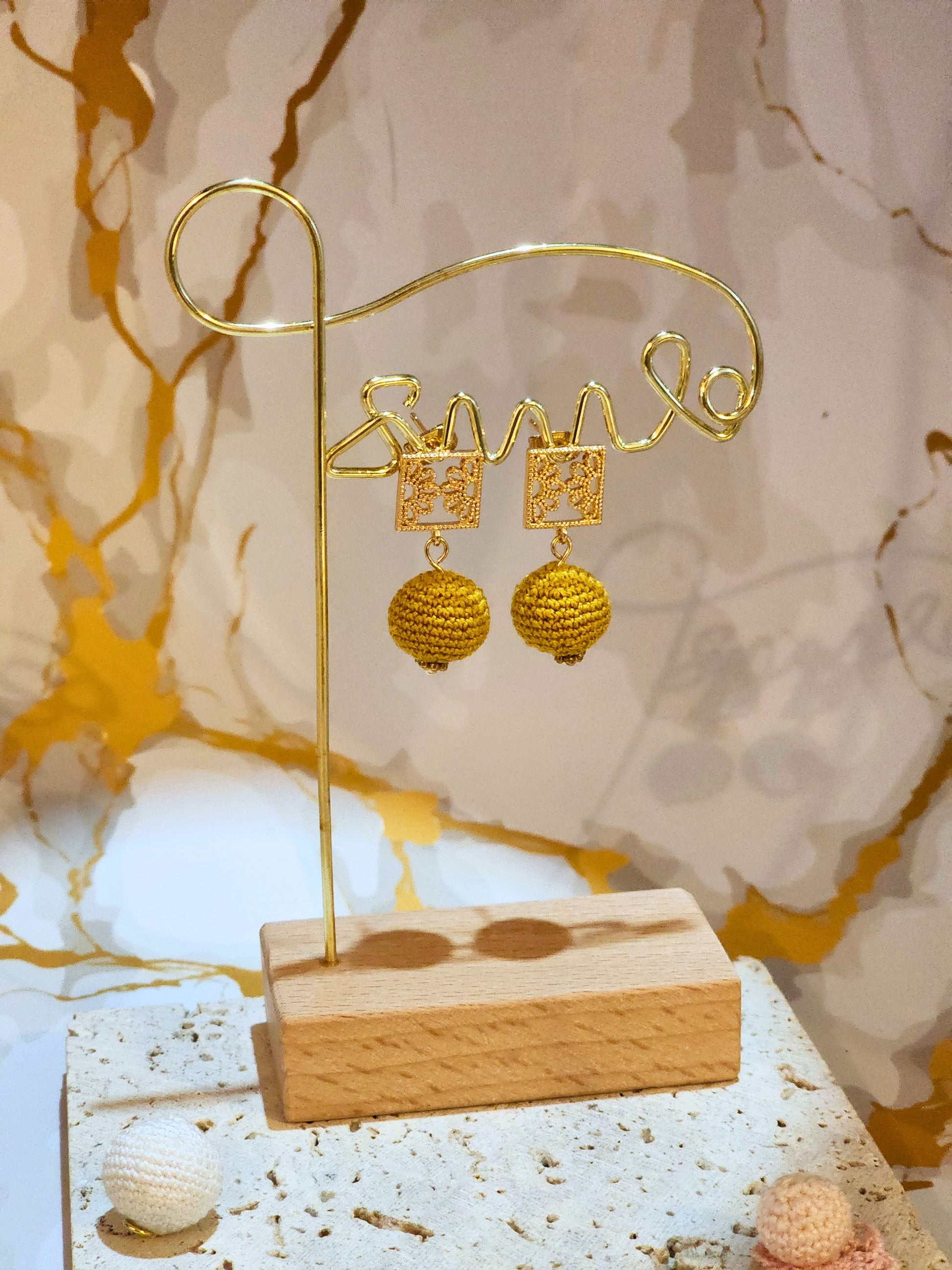 Handcrafted gold crochet pearls inspired by luxurious South Sea pearls. Finished with 18K gold-plated lace studs.