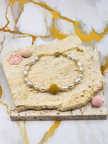 Handcrafted “gold crochet pearl” bracelet inspired by luminous South Sea pearls. Beautifully framed by 5–6mm high lustre, flawless teardrop-shaped pearls. Styled with 18K gold-plated bead accents and clasp.