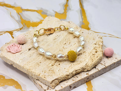 Handcrafted “gold micro crochet pearl” beautifully framed by 8–9mm high lustre, flawless teardrop-shaped pearls. Styled with 18K gold-plated bead accents and clasp accented with cubic zirconia.
