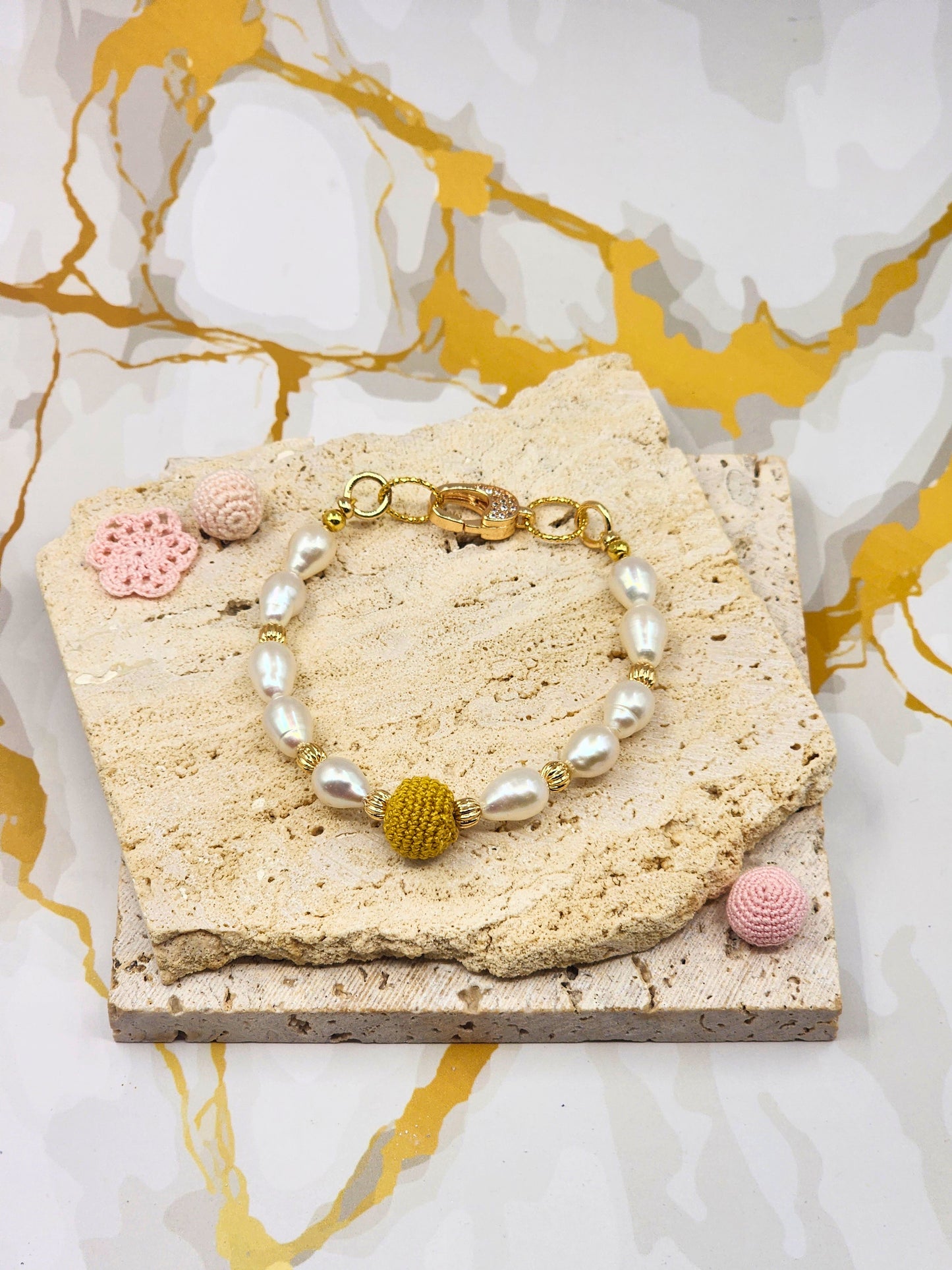 Handcrafted “gold micro crochet pearl” beautifully framed by 8–9mm high lustre, flawless teardrop-shaped pearls. Styled with 18K gold-plated bead accents and clasp accented with cubic zirconia.