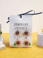 A pair of limited edition micro-crochet sunflower drop earrings