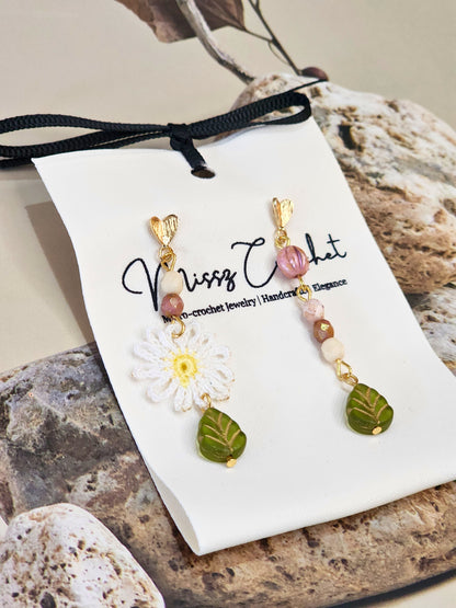 Handcrafted daisy asymmetrical earrings with vintage glass beads & 18K gold-plated ear hooks. 