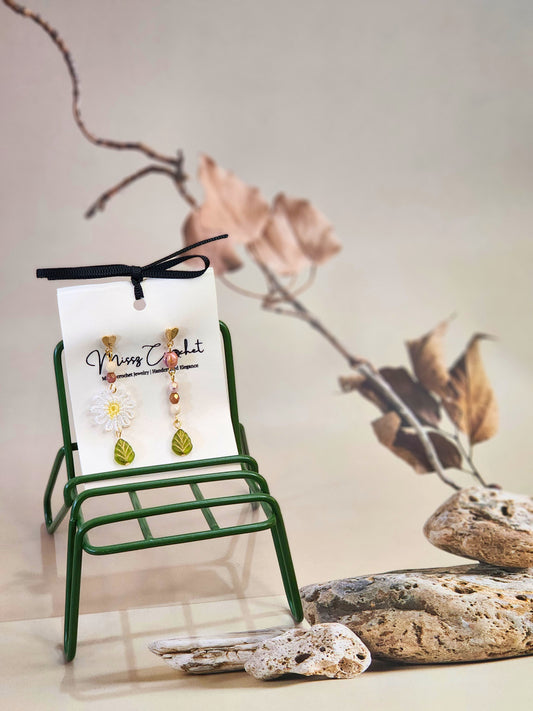 Handcrafted daisy asymmetrical earrings with vintage glass beads & 18K gold-plated ear hooks. 