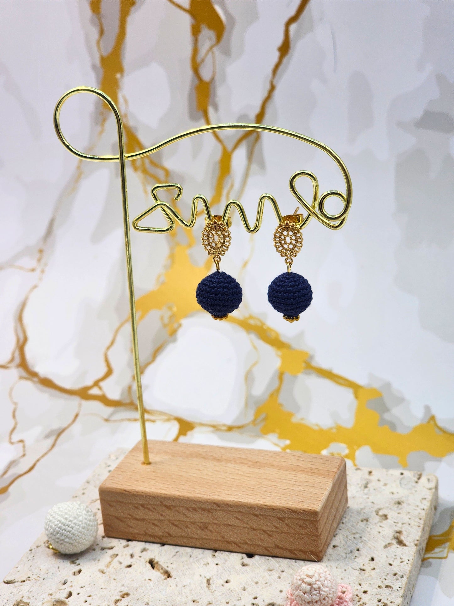 Handcrafted deep blue crochet pearls inspired by the mysterious beauty of Tahitian pearls. Finished with 18K gold-plated lace studs.