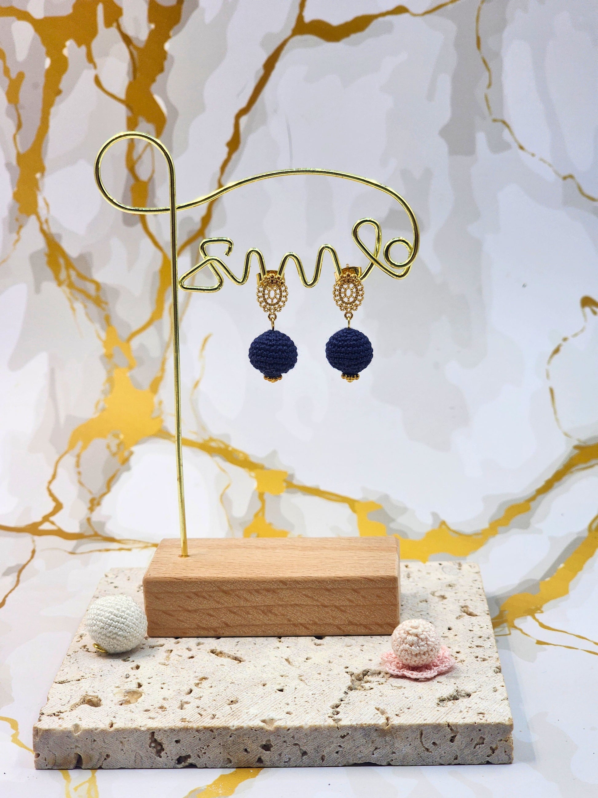 Handcrafted deep blue crochet pearls inspired by the mysterious beauty of Tahitian pearls. Finished with 18K gold-plated lace studs.