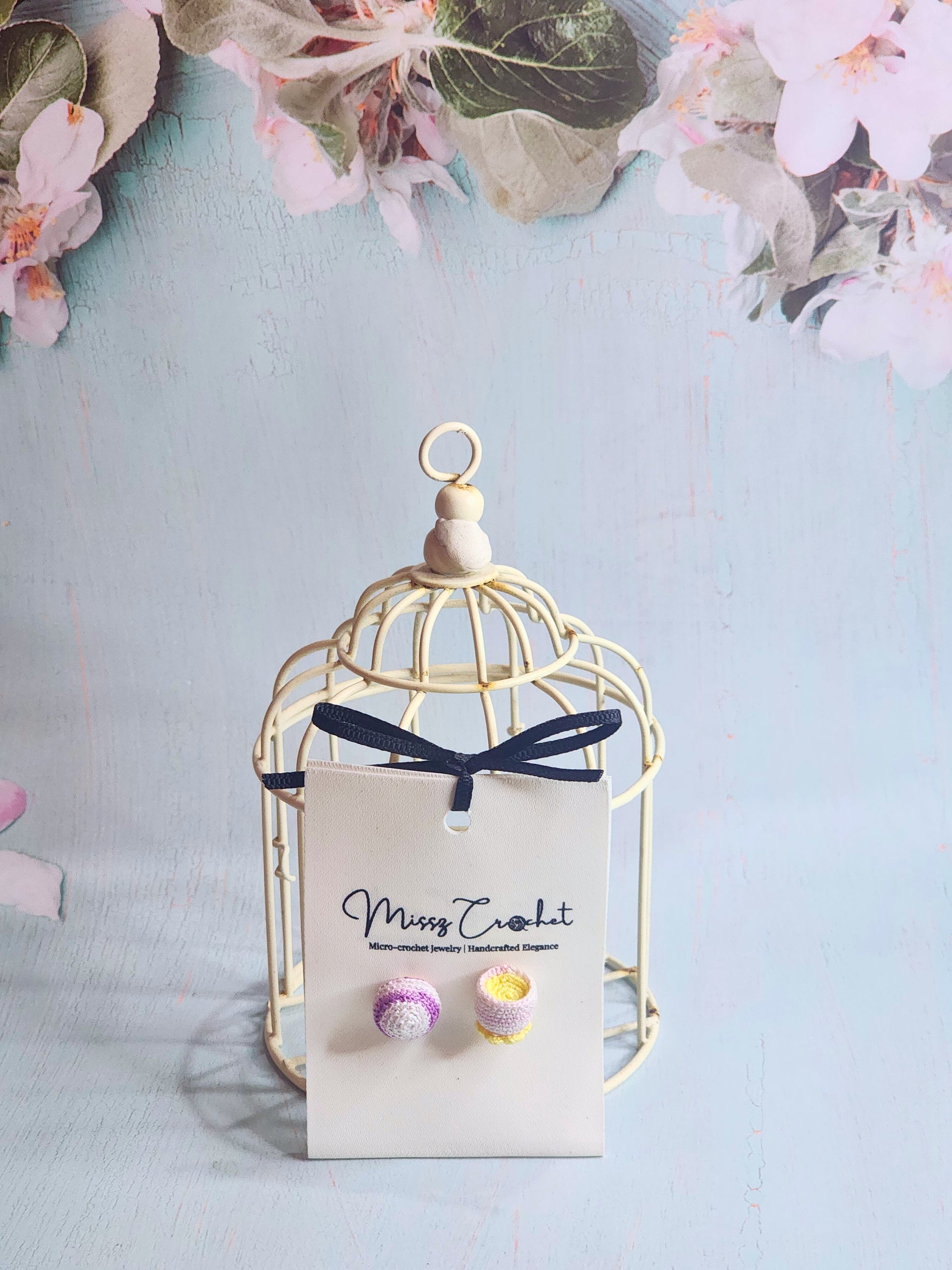 Handcrafted amigurumi earrings feature a micro-crochet taro pastry, and a teacup. Set with 18K gold-plated ear studs.