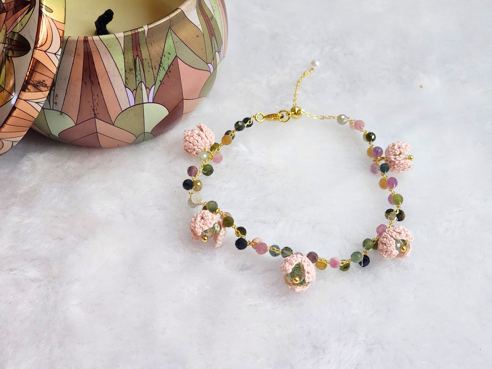 Natural Tourmaline Crystal bracelet with pink snowdrops, crowned with sparkling Czech crystals. On 14K gold-plated bracelet with extension chain.