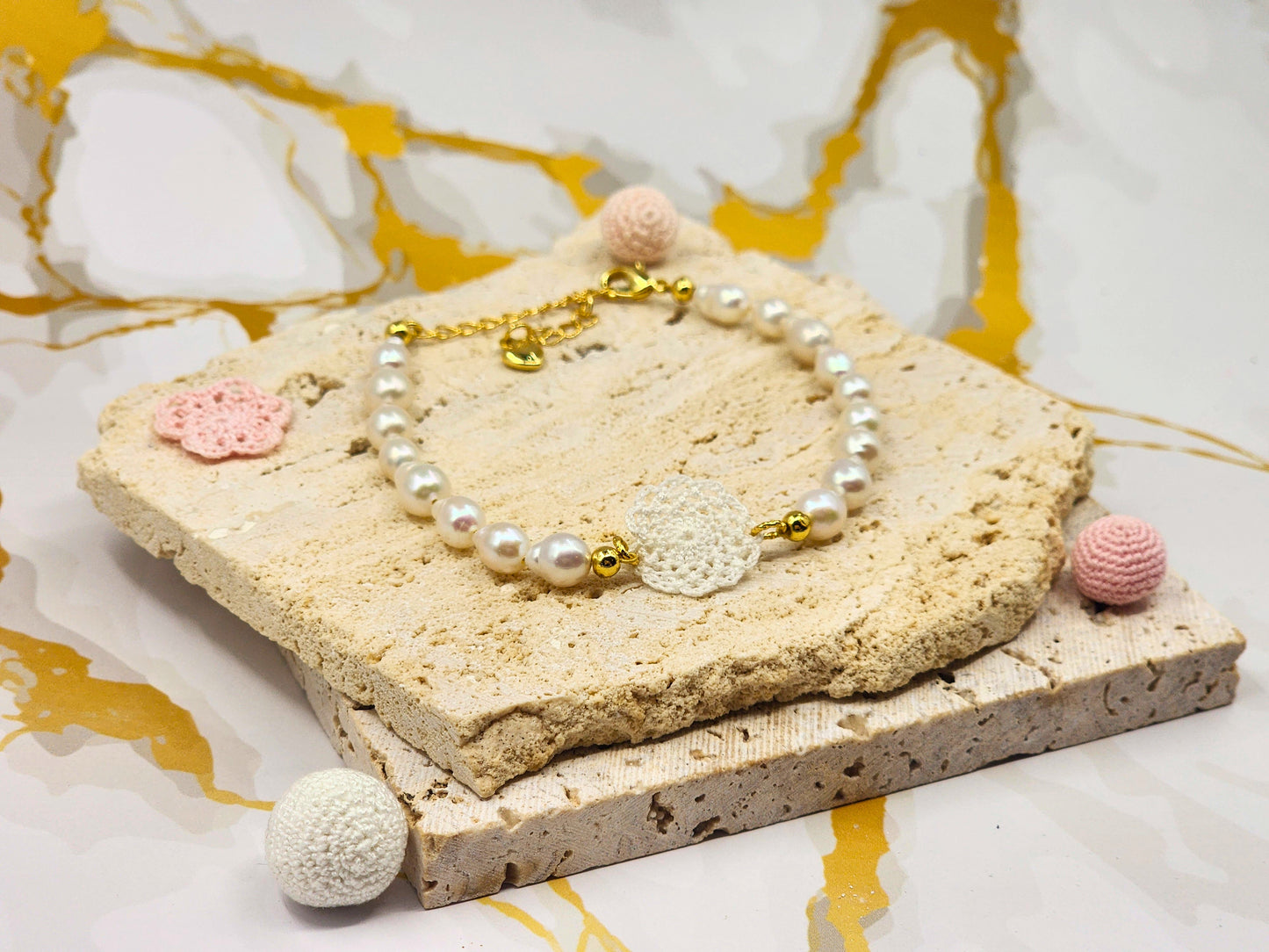 Handcrafted lace motif, beautifully framed by flawless 7–8mm teardrop-shaped pearls bracelet. Styled with 18K gold-plated bead accents and clasp.