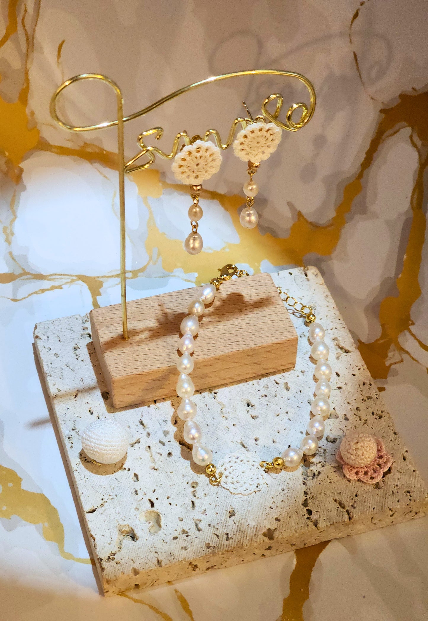 Handcrafted lace motif, beautifully framed by flawless 7–8mm teardrop-shaped pearls bracelet. Styled with 18K gold-plated bead accents and clasp.